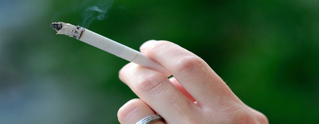 Hand of smoking person