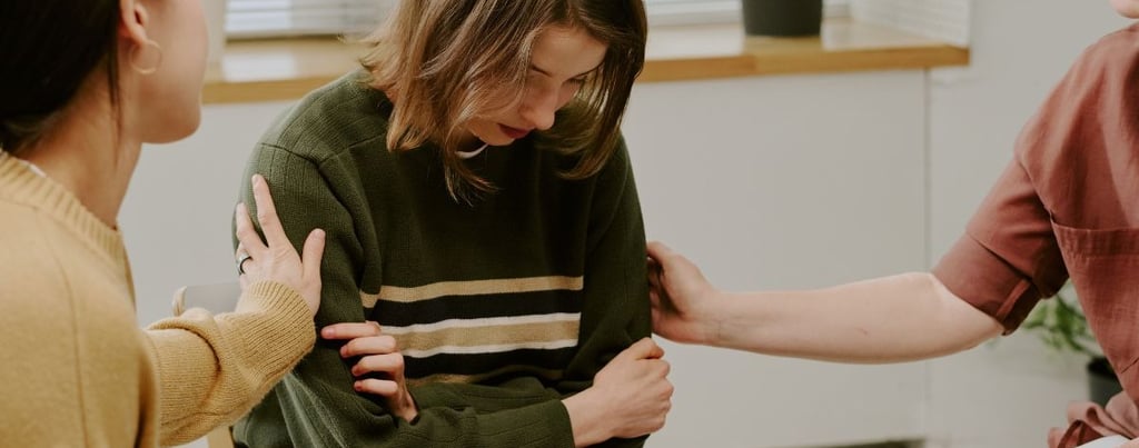 a women comforting someone