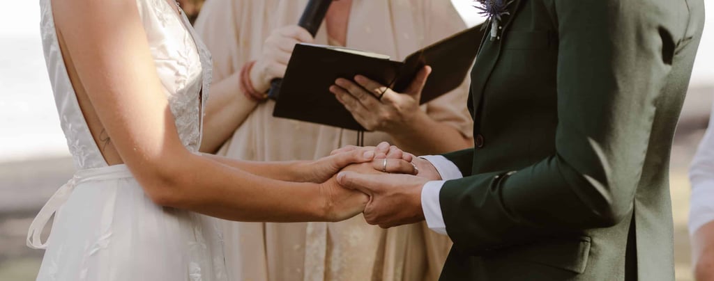 a man and woman holding hands while holding hands