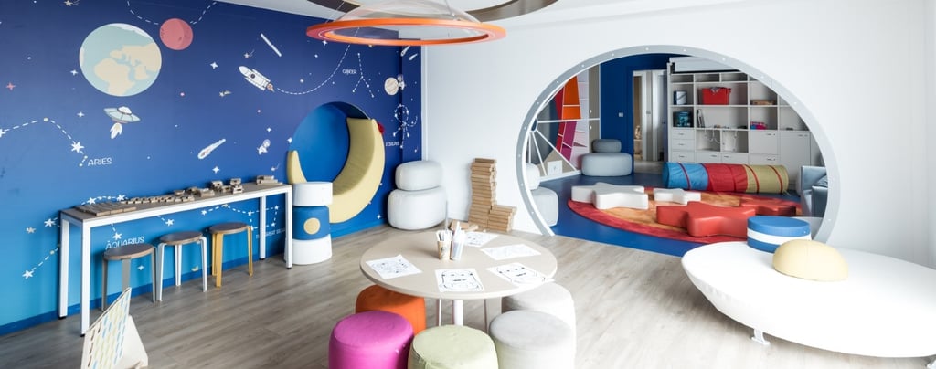 Ikos Olivia Heros kids Club with colourful seats and space theme 