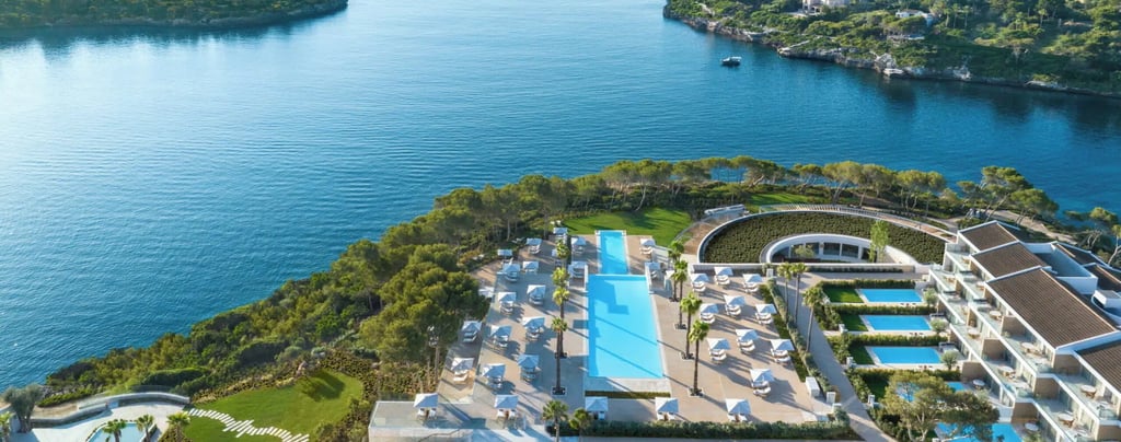 Ikos Porto Petra swimming pool and hotel overlooking the sea 