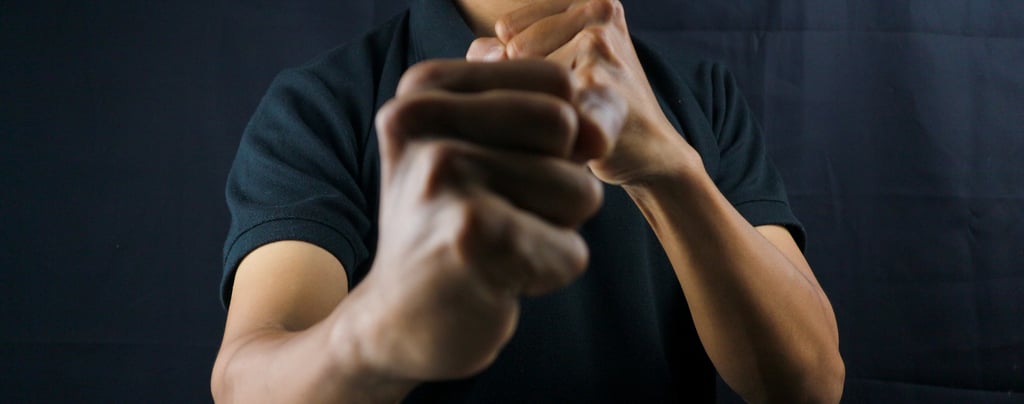 a man in a black shirt self defense move