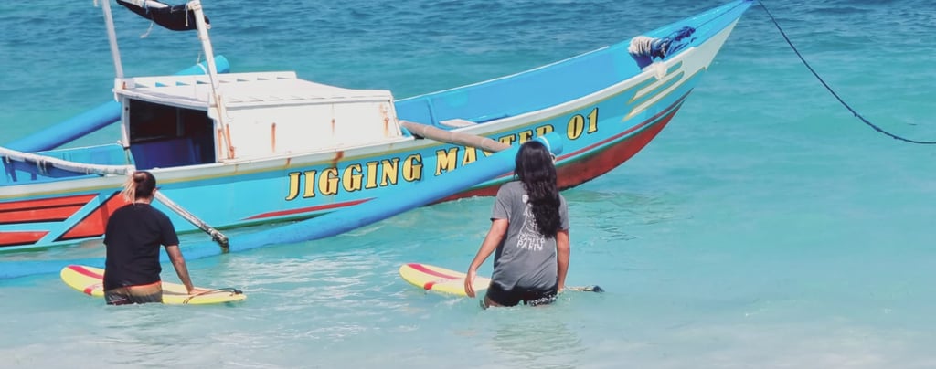 a man and woman are standing in the water