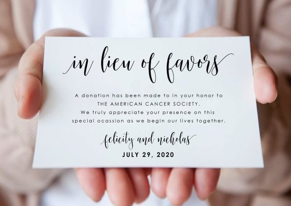 a person holding a wedding donation card