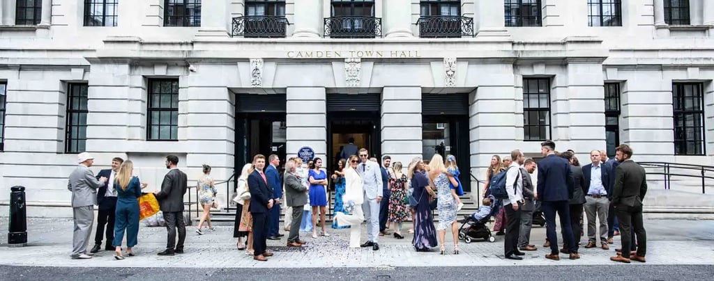 wedding party standing outside Camden Town Hall