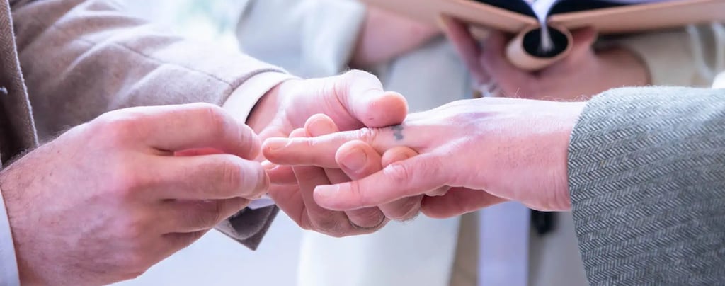 two grooms  holding hands in a wedding ceremony