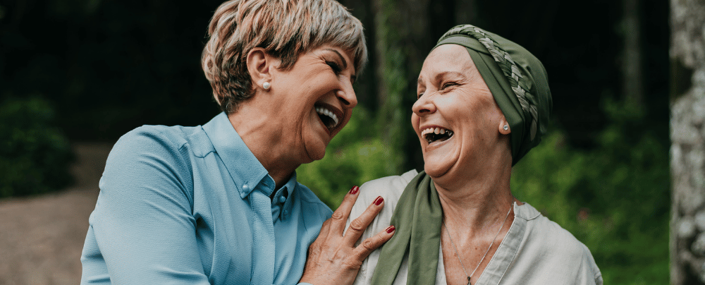 two older women supporting each other  to deal with "scanxiety"
