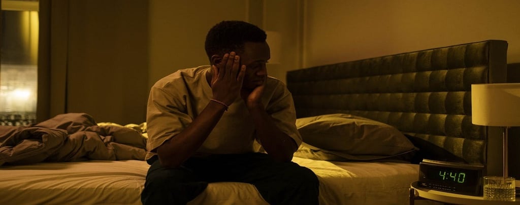 A man sitting on the bed