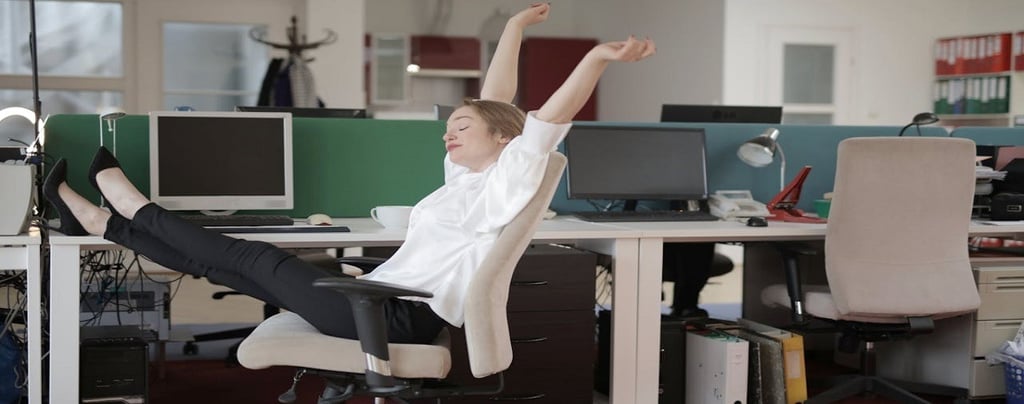 A Girl Relaxing in Office Chair