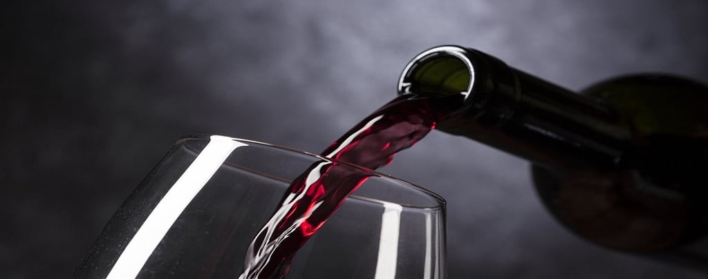 Pouring red wine in a glass