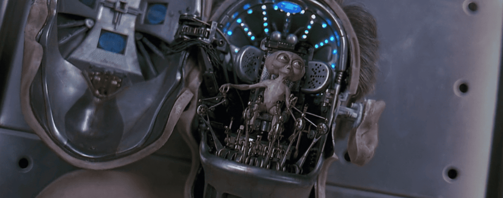 Men in Black alien brain controller, symbolizing the concept of the human brain as an independent entity or flesh mech pilot