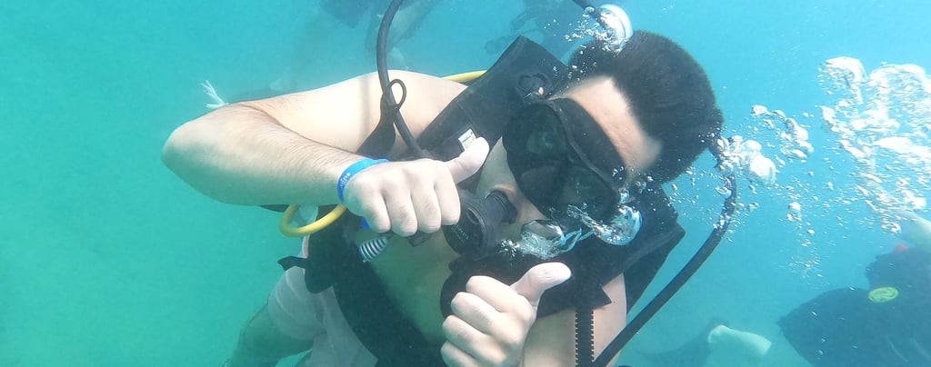 a man in a diving suit and scuba goggles