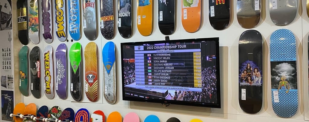 a wall of skateboards and skateboards on display