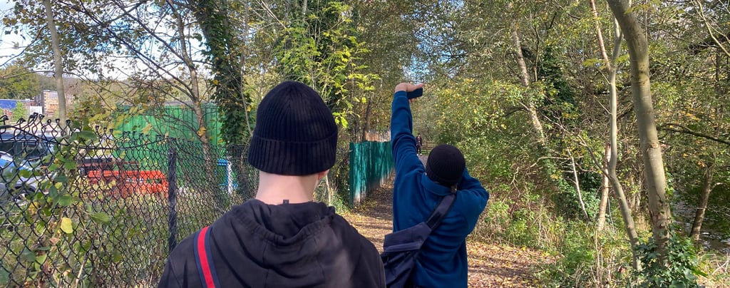 two friends are walking down a path