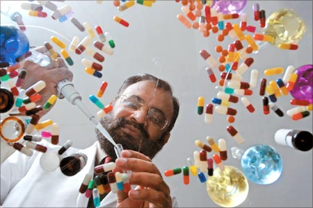 a man with a beard and glasses is holding a pair of scissors and scissors
