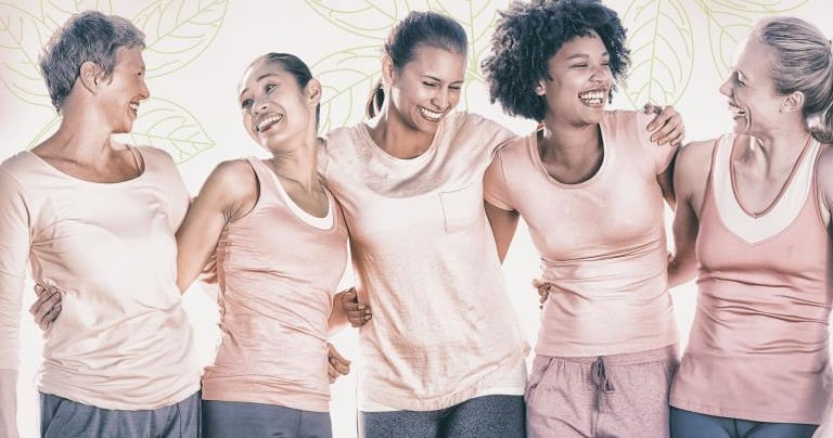 a group of women in pink shirts and pants