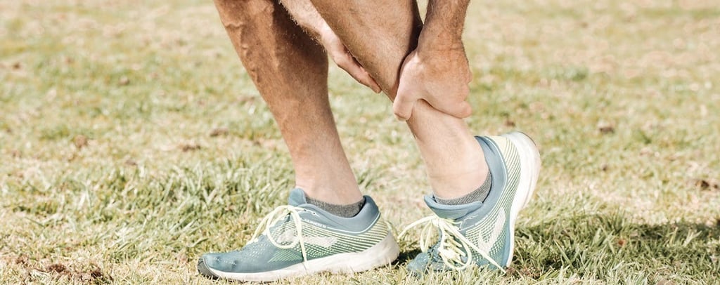 Man holding his Ankle