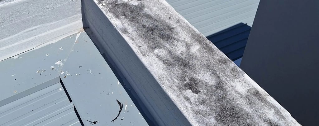 Roof flashing lifted near parapet wall
