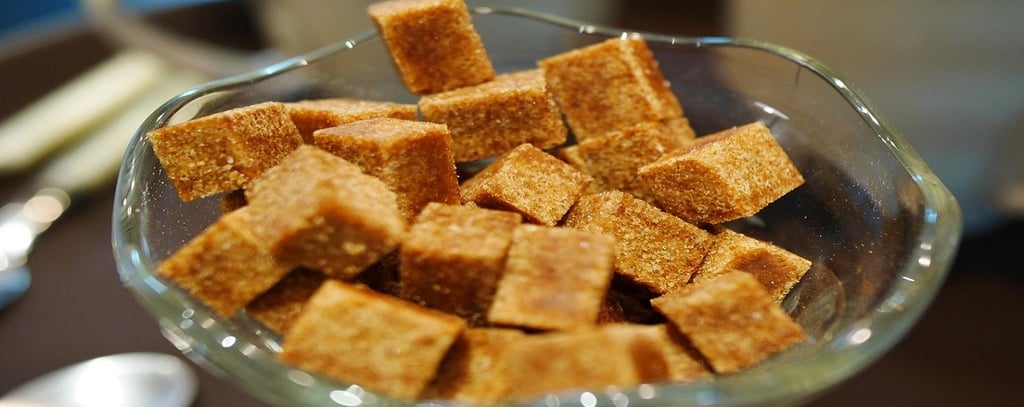 Brown sugar cubes in a glass bowl