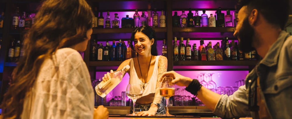 a sugar mommy is standing in front of a bar