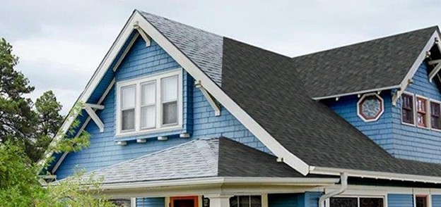 Picture of a roof showcasing old vs new roof on a house