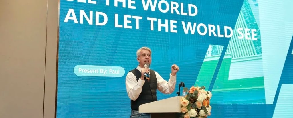 a man standing at a podium with a microphone and a microphone