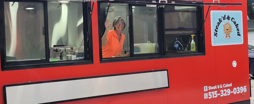 Cindy Niemier at serving window inside food trailer