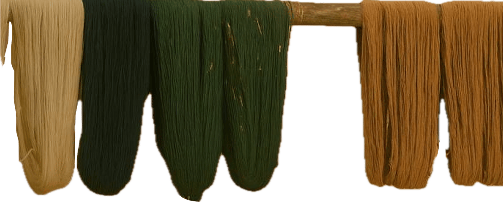 Hand- dyed wool yarns drying on a wooden frame
