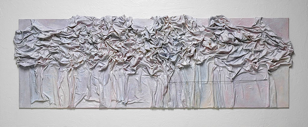 Textured mixed media wall art featuring draped white fabric on a rectangular canvas.