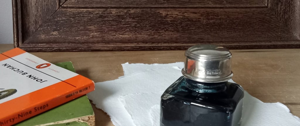 J Herbin Paris ink bottle with silver lid and pen rest