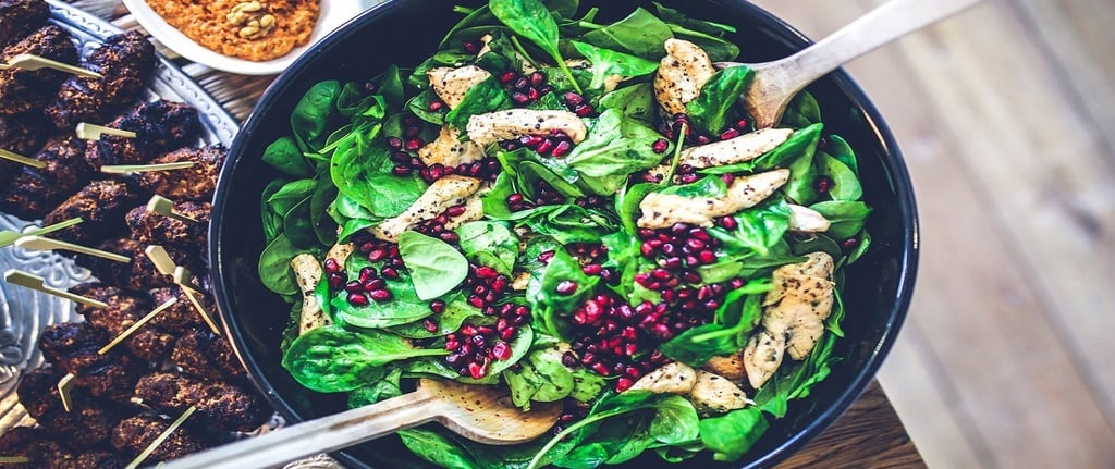 Spinach, Chicken, and Pomegranate in a Bowl
