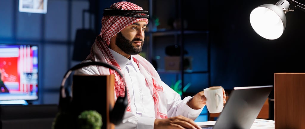 side-view-muslim-guy-holding-cup-coffee-surfing-net-his-digital-laptop-image-showcasing-male-arab-person-engrossed-his-person
