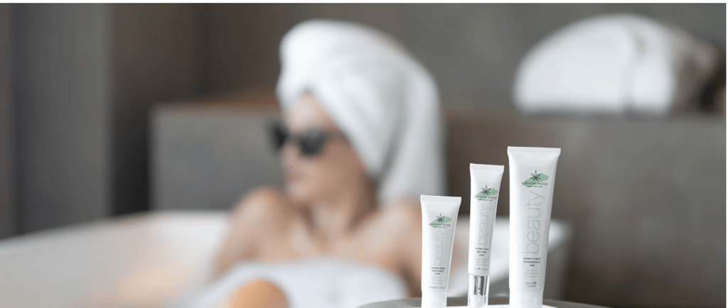 a woman in a towel and selfcare products