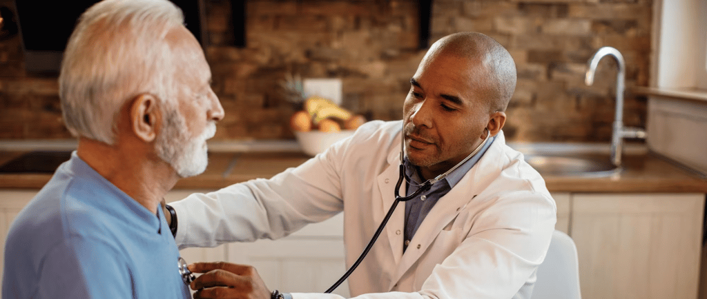 a doctor checking an elderly's heartbeat