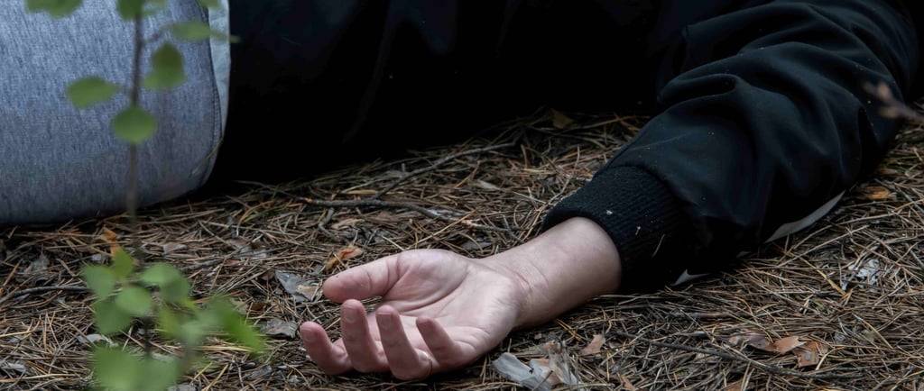 Image of woman lying on ground, doubtless because she's fainted from of a lack of food.