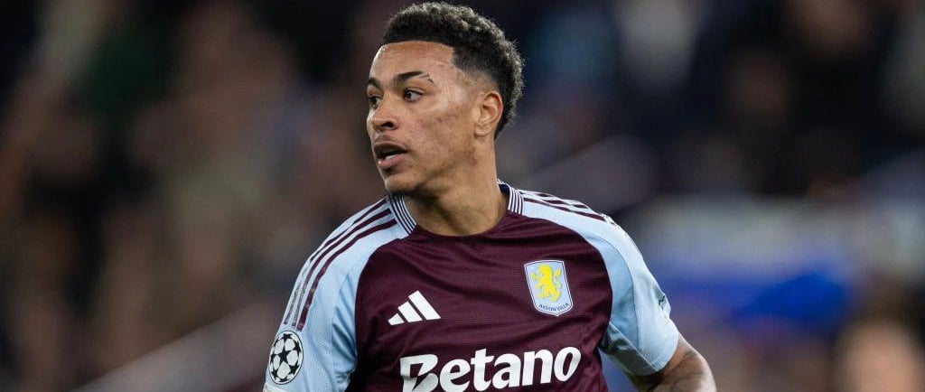 a soccer player in a maroon jersey and a white shirt