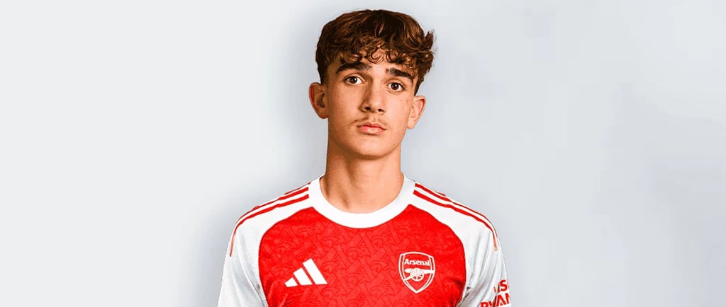 a man in a red and white shirt and shorts