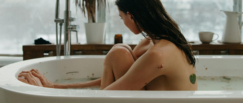 a woman sitting in a bathtub