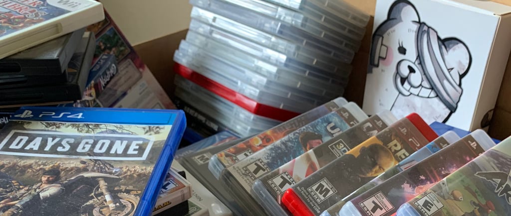 Backlog box full of video games.