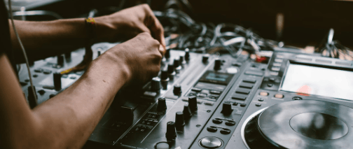 a dj mixing up a music event using a djm mixer