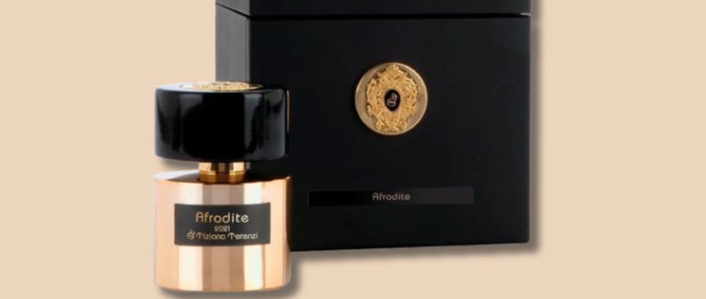 a bottle of perfume with a black box and a gold medal - afrodite da tiziana terenzi