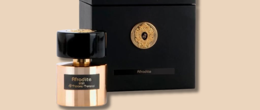 a bottle of perfume with a black box and a gold medal