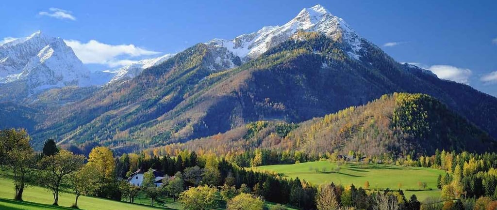 a mountain range with a view of a valley