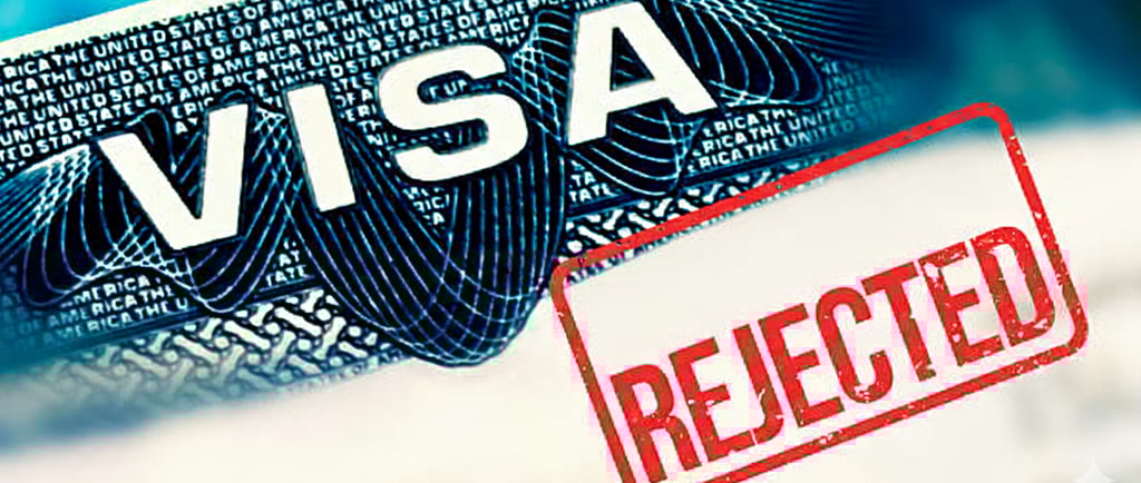 Close-up of a visa document with the word VISA visible, overlaid with a large red, rubber-stamp styl