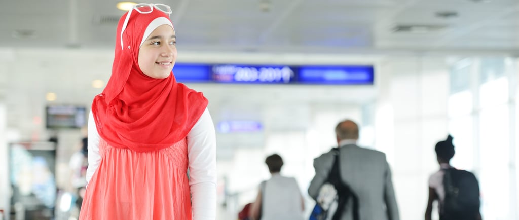 a woman in a red dress and a man in a suit for boarding