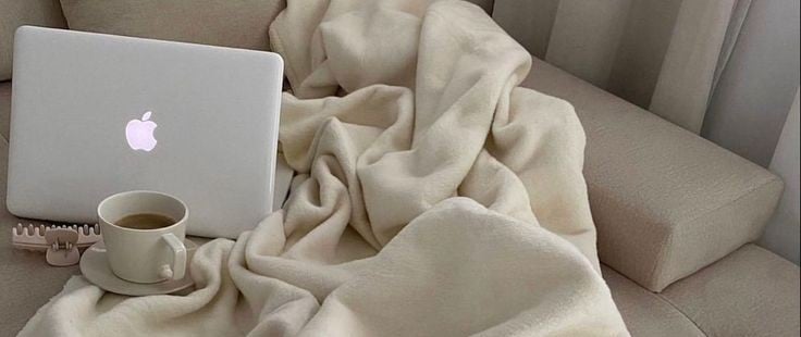 affiliate marketing laptop on sofa lifestyle photo