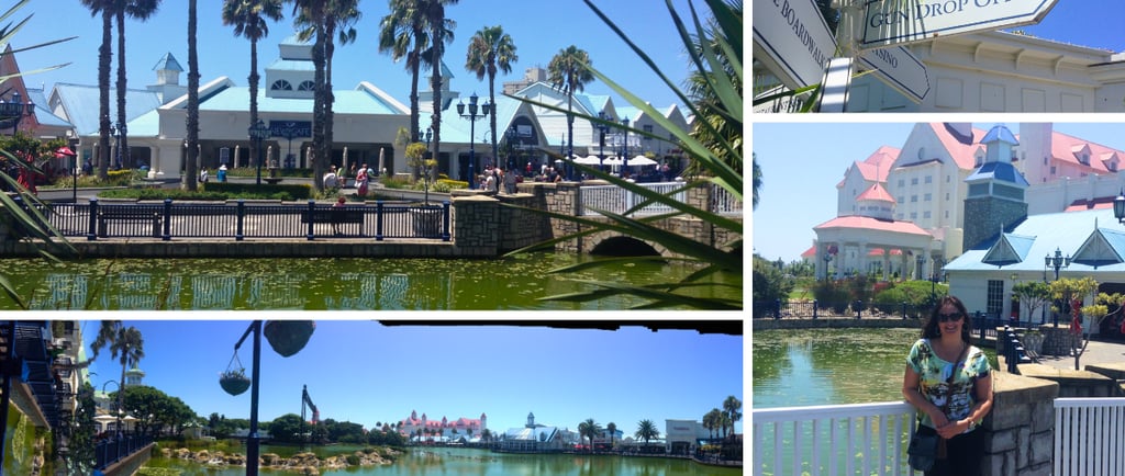 Autora explorando o Boardwalk em Port Elizabeth (Nelson Mandela Bay), com lojas, entretenimento e lago ao fundo