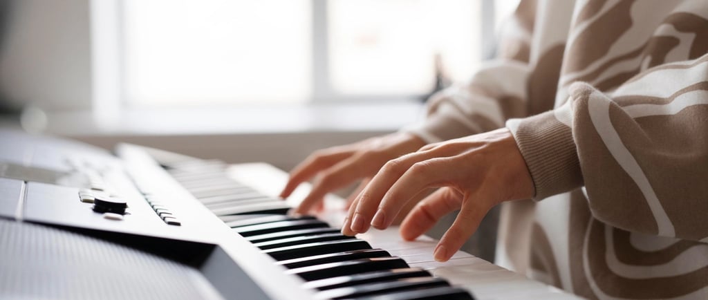 a person playing a keyboard with a keyboard