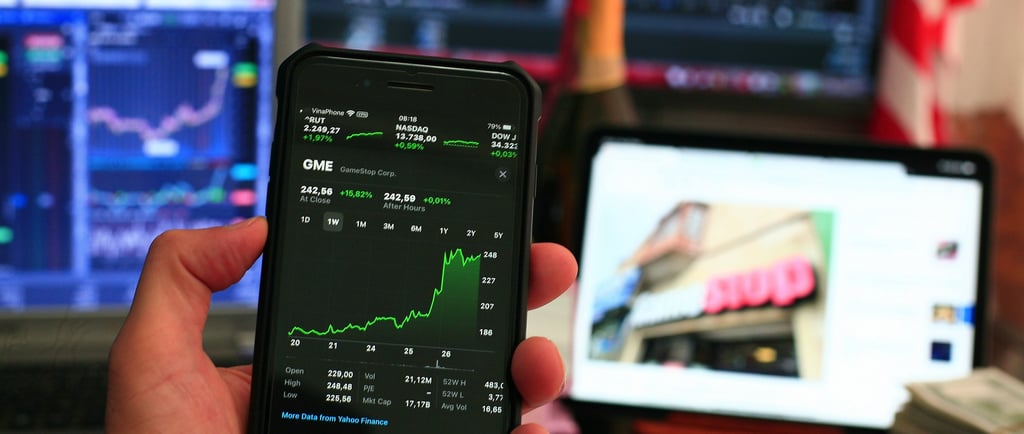 phone showing investing chart symbolizing market volatility