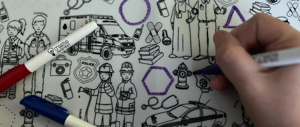 Child practicing letters on Scribbly Kids My First Alphabet reusable drawing mat